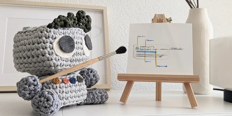 Crochet doll of a web developer giving a presentation